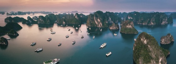Limestone islands in Ha Long Bay at sunset